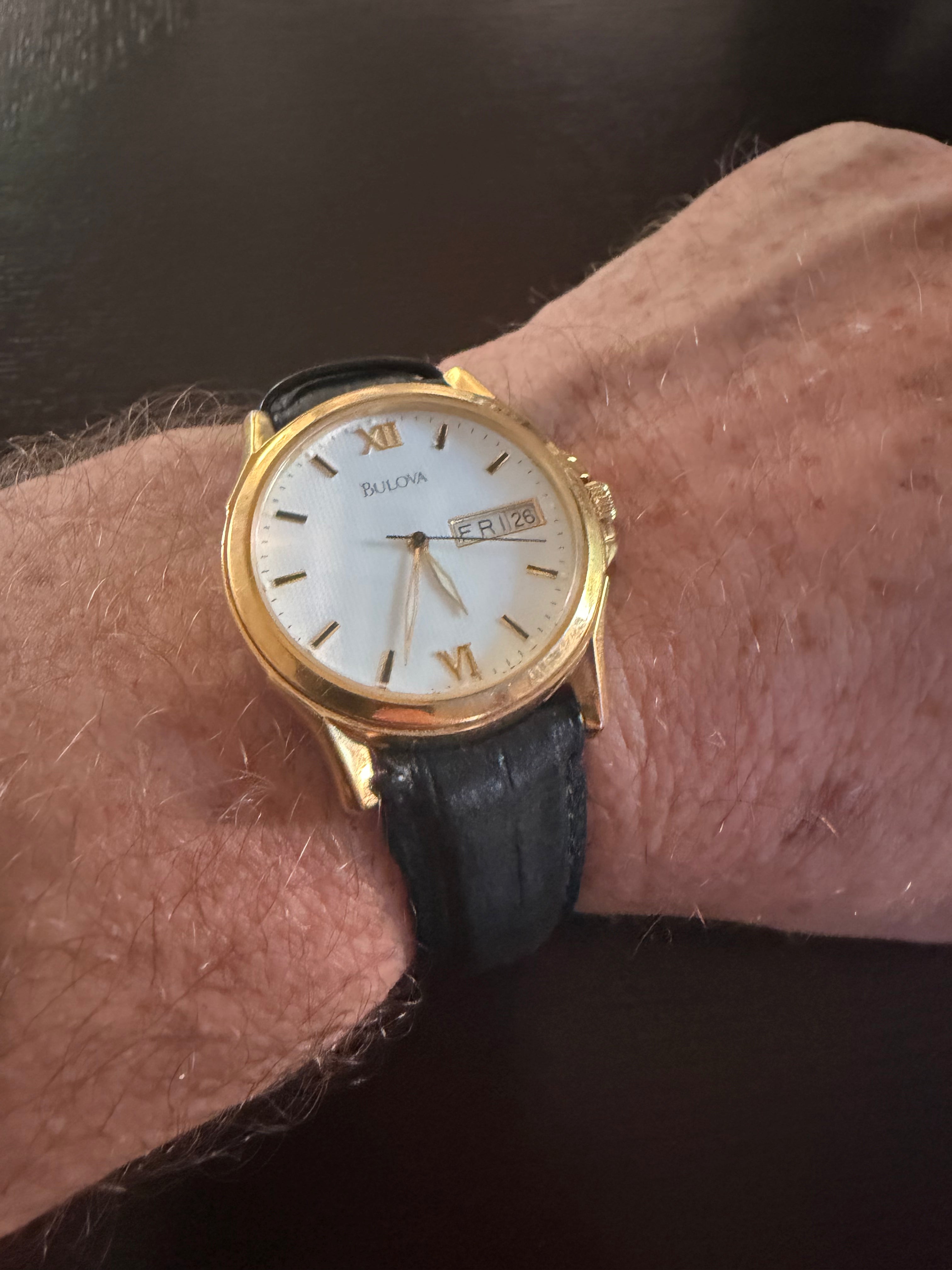 Bulova Men’s Gold Tone Quartz Dress Watch Day Date White Dial Black Leather Strap