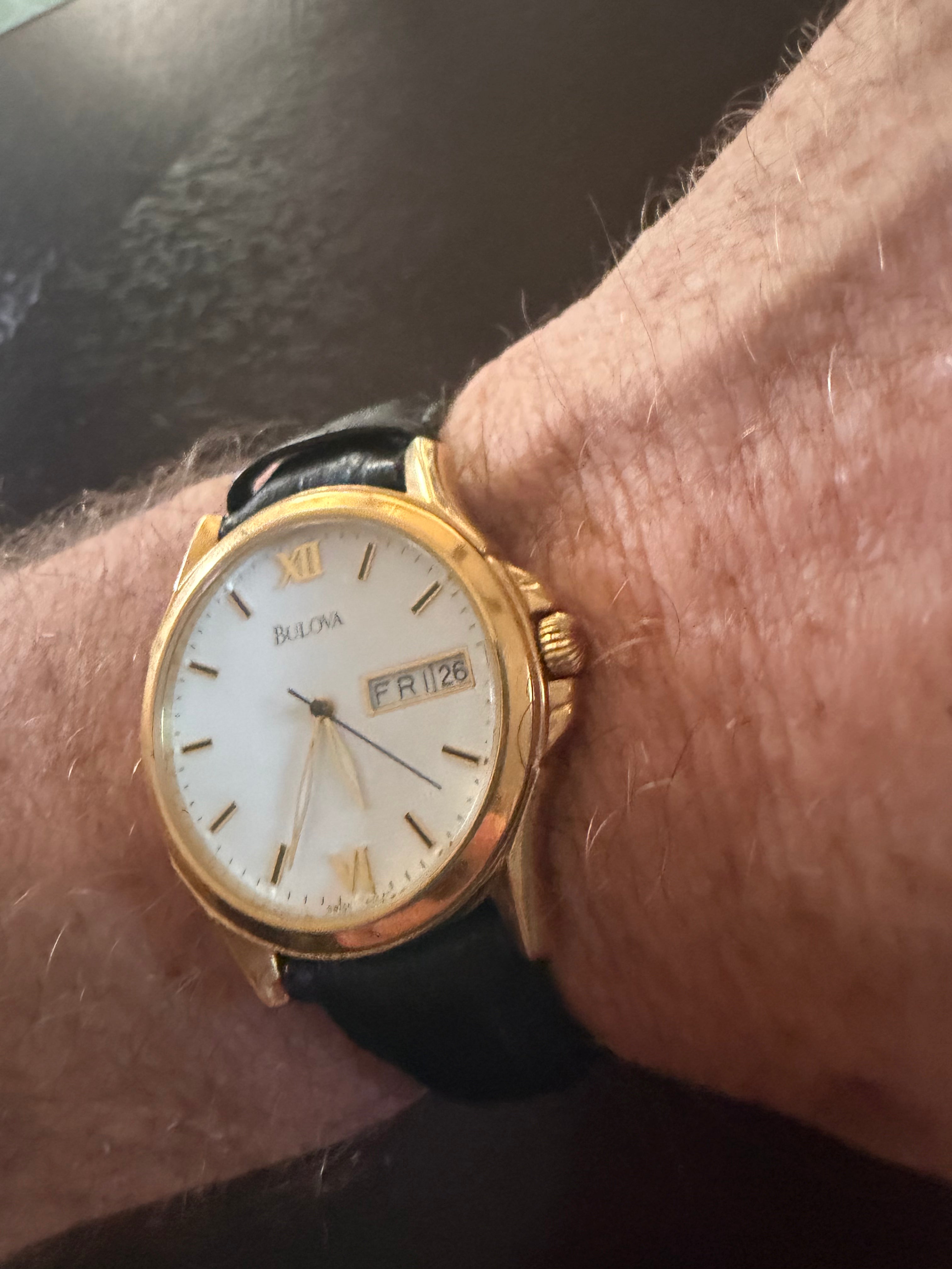 Bulova Men’s Gold Tone Quartz Dress Watch Day Date White Dial Black Leather Strap