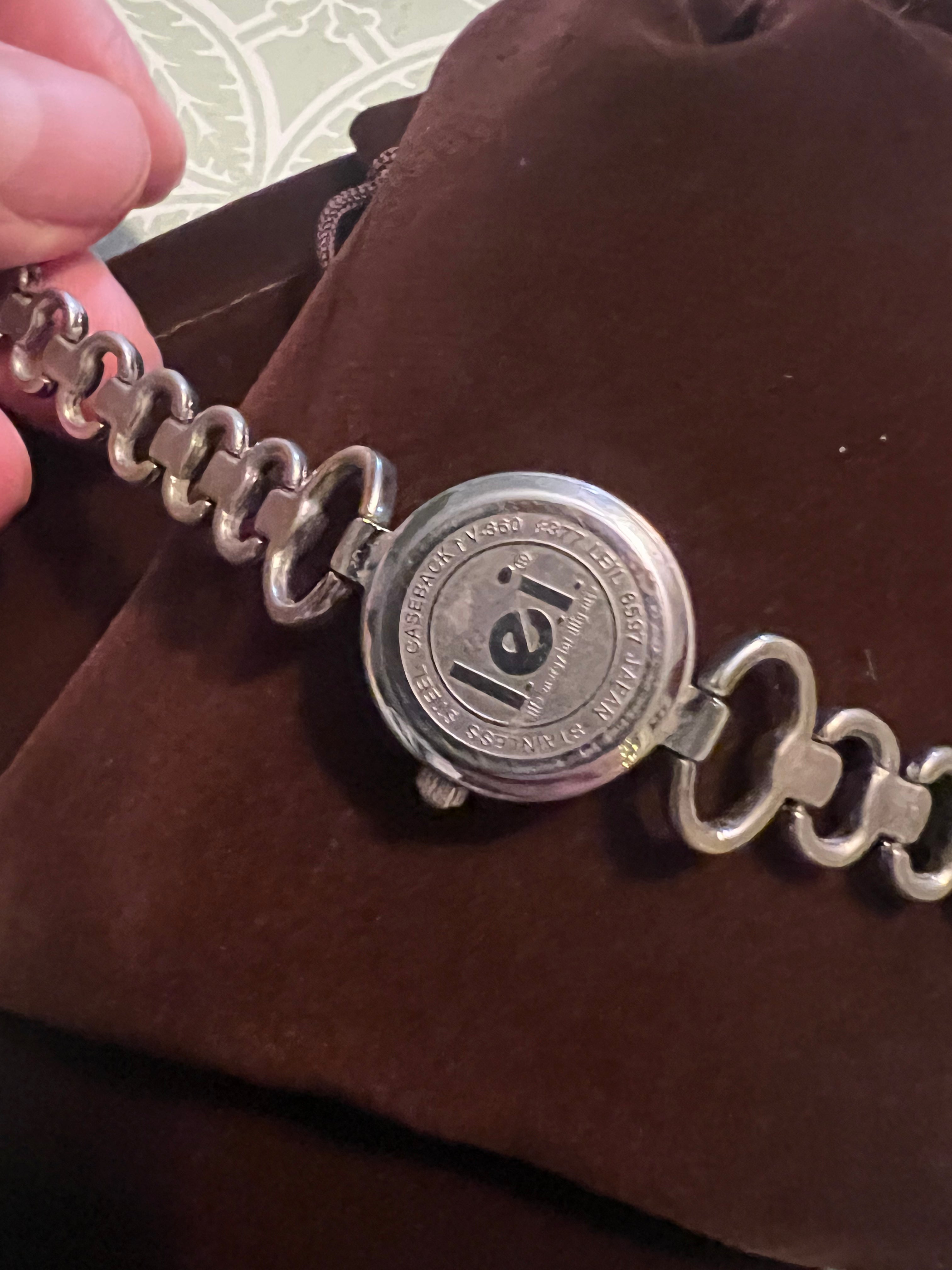 90’s LEI dainty ladies watch. Silver tone, pink dial, new battery, gasket, and gift pouch