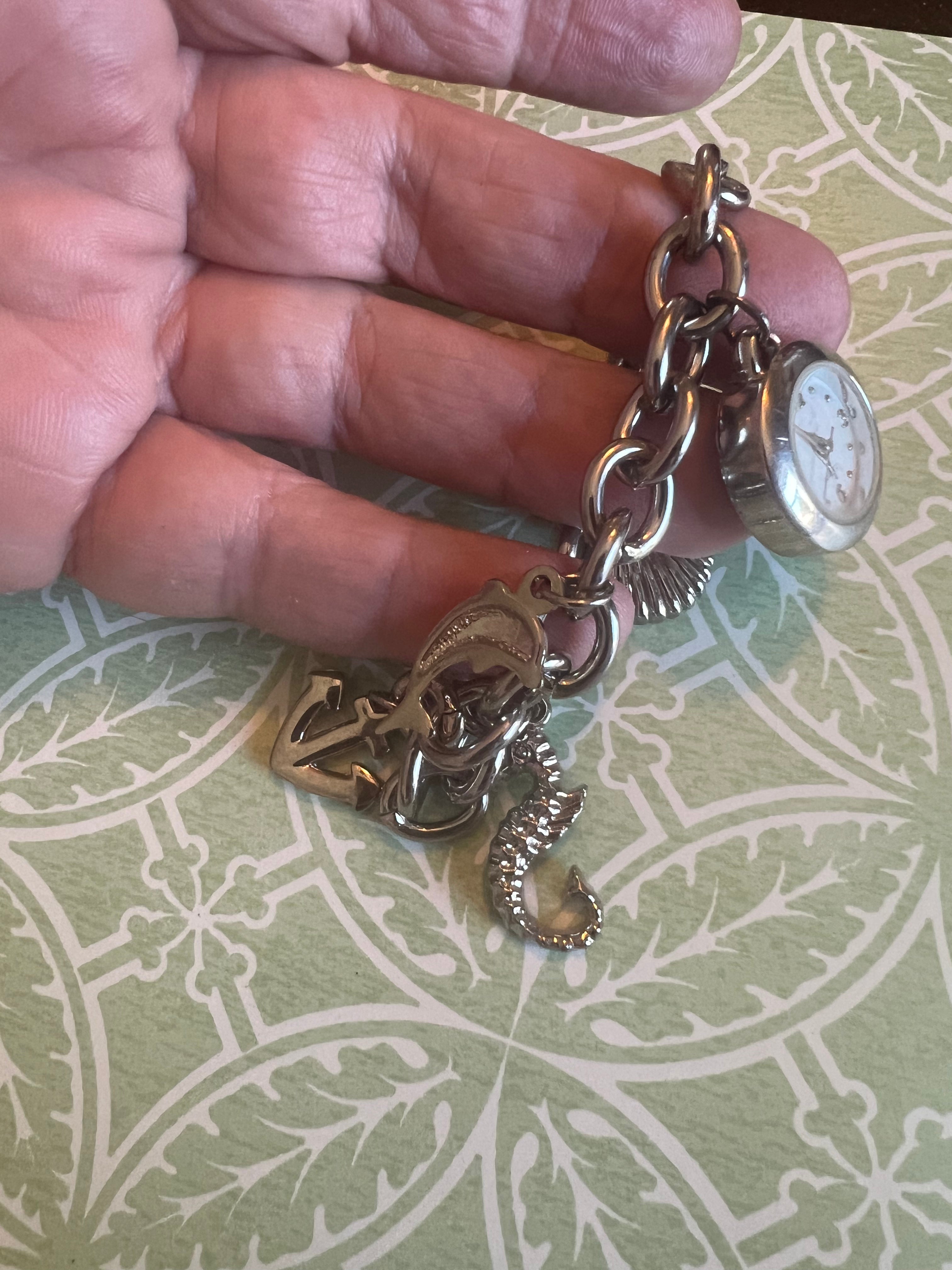 Ladies ocean themed charm bracelet watch. New battery.