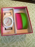 Ladies white with multicolored trim watch. Interchangeable pink and green straps