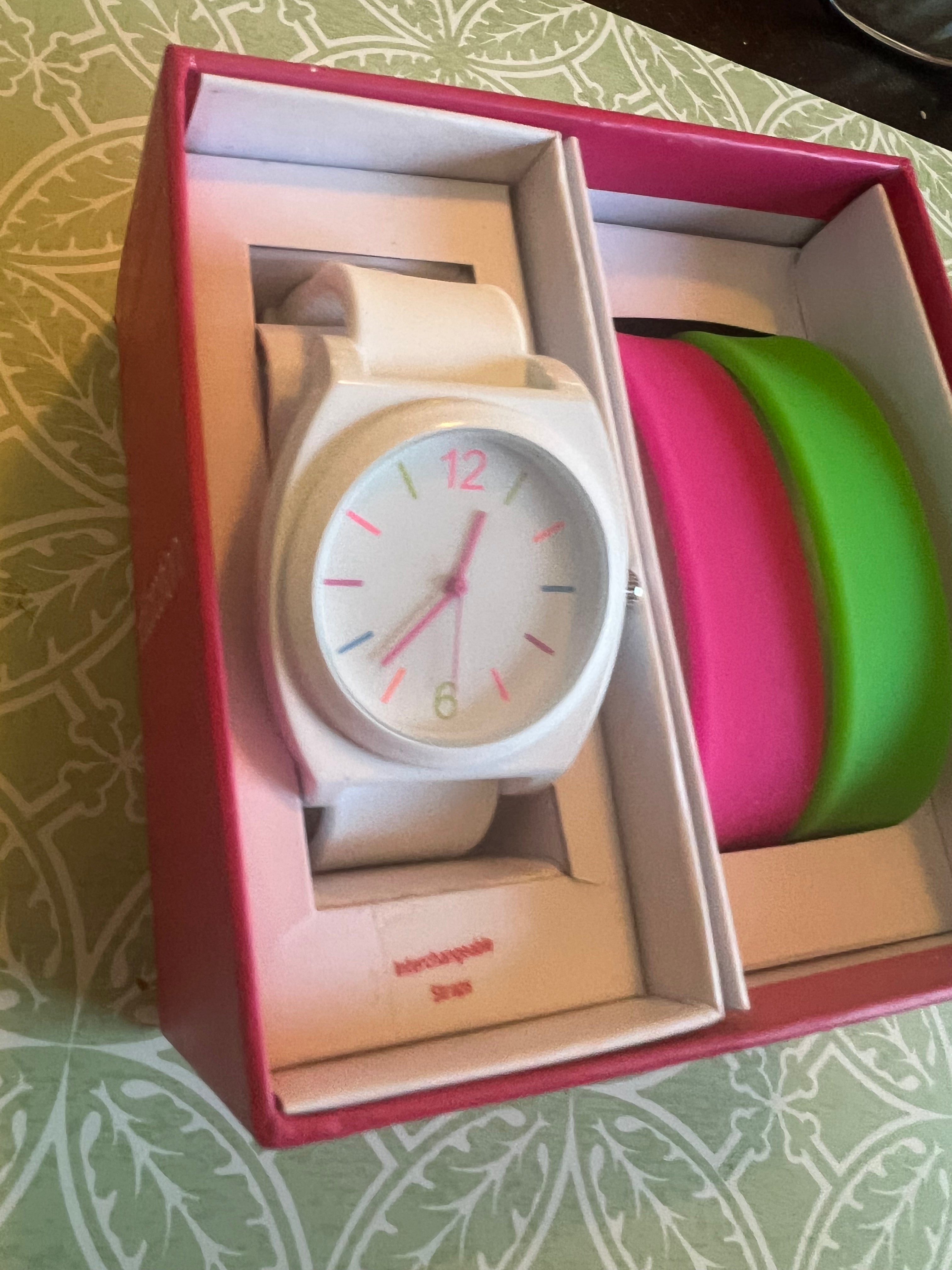 Ladies white with multicolored trim watch. Interchangeable pink and green straps