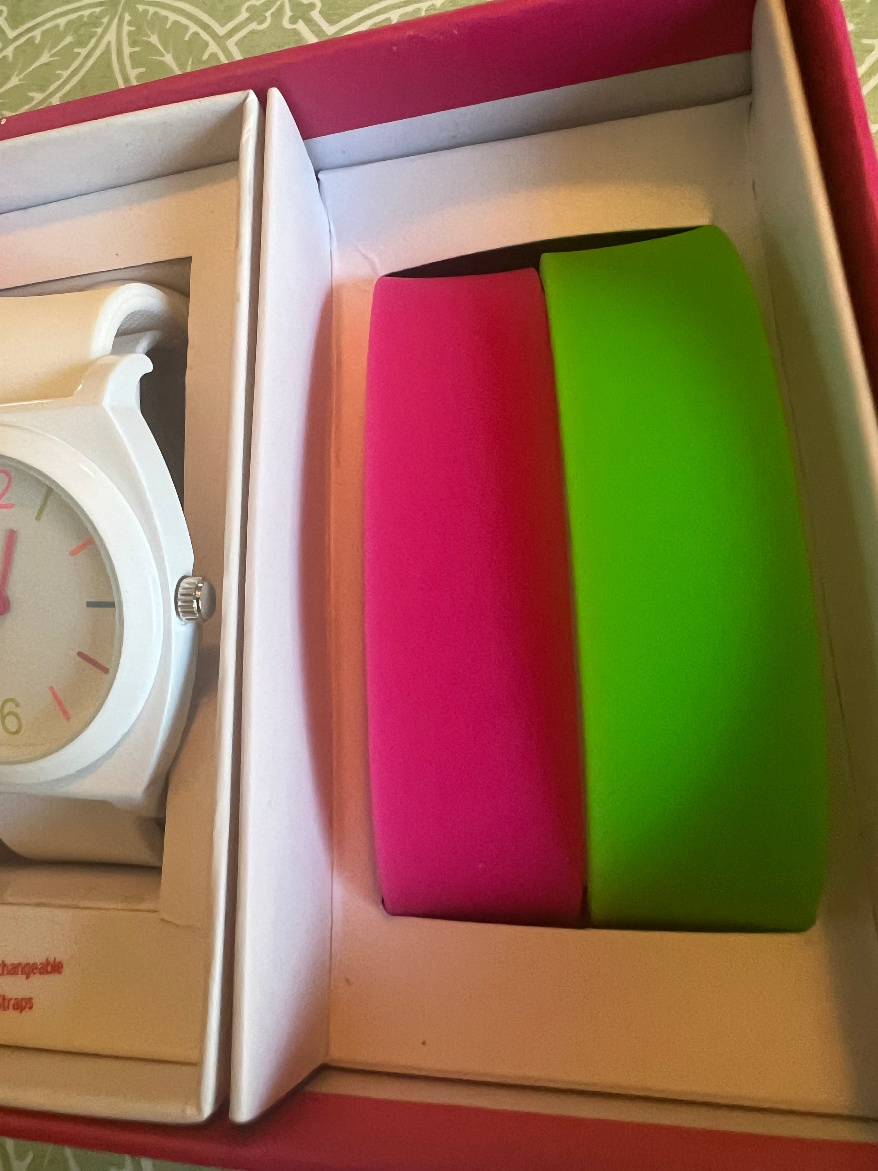 Ladies white with multicolored trim watch. Interchangeable pink and green straps