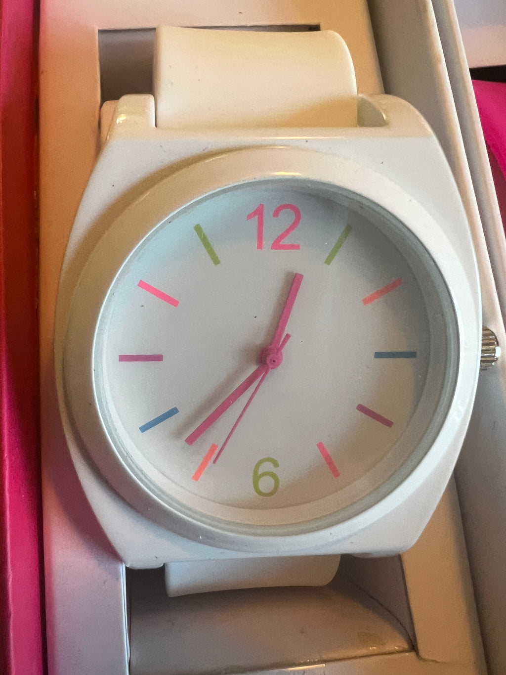 Ladies white with multicolored trim watch. Interchangeable pink and green straps