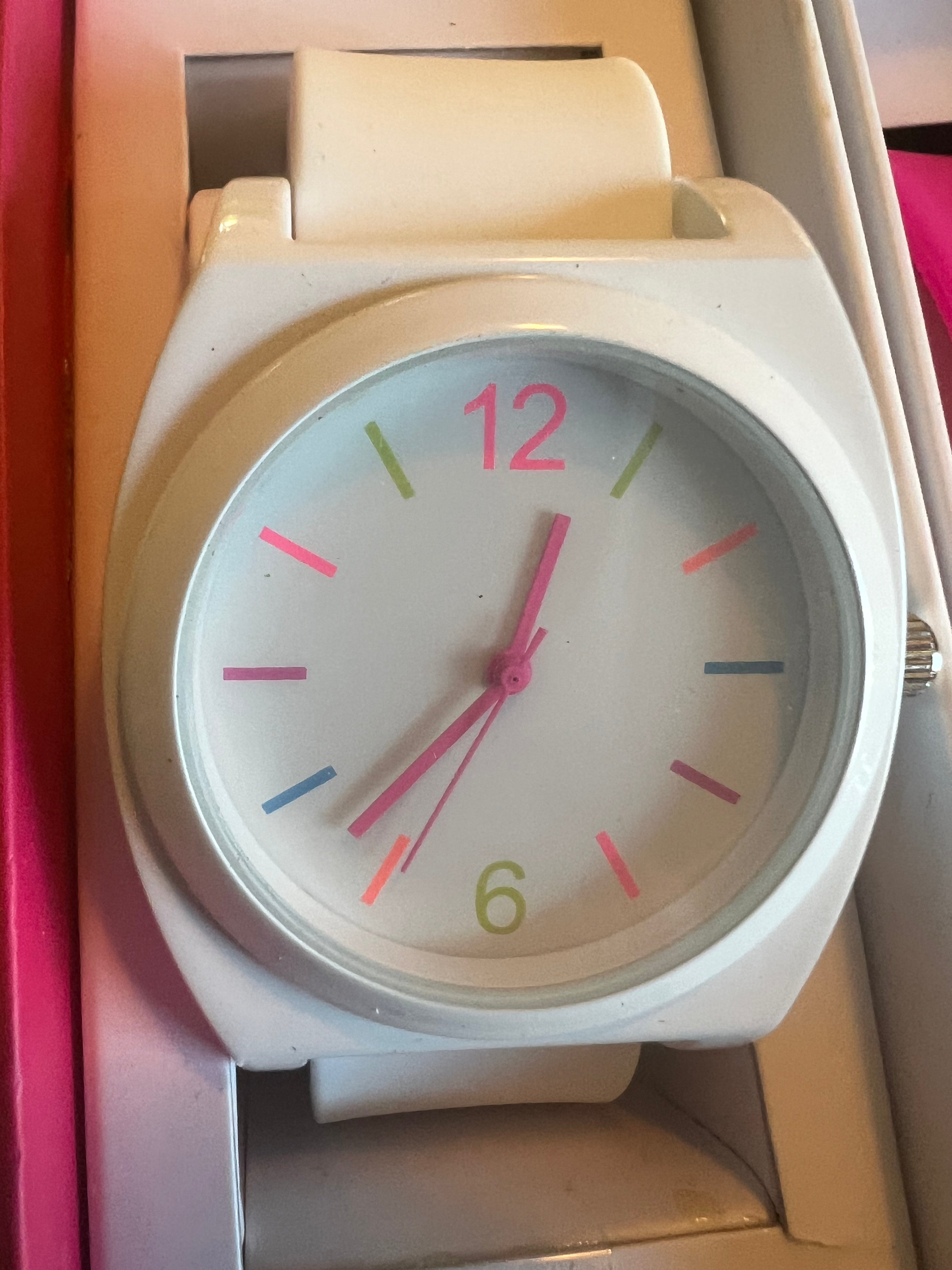 Ladies white with multicolored trim watch. Interchangeable pink and green straps