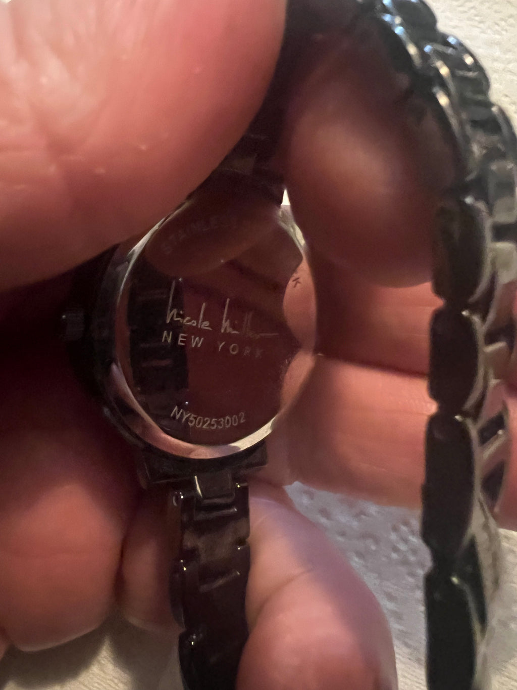 Ladies Nicole Miller dress watch gray embossed detail dial
