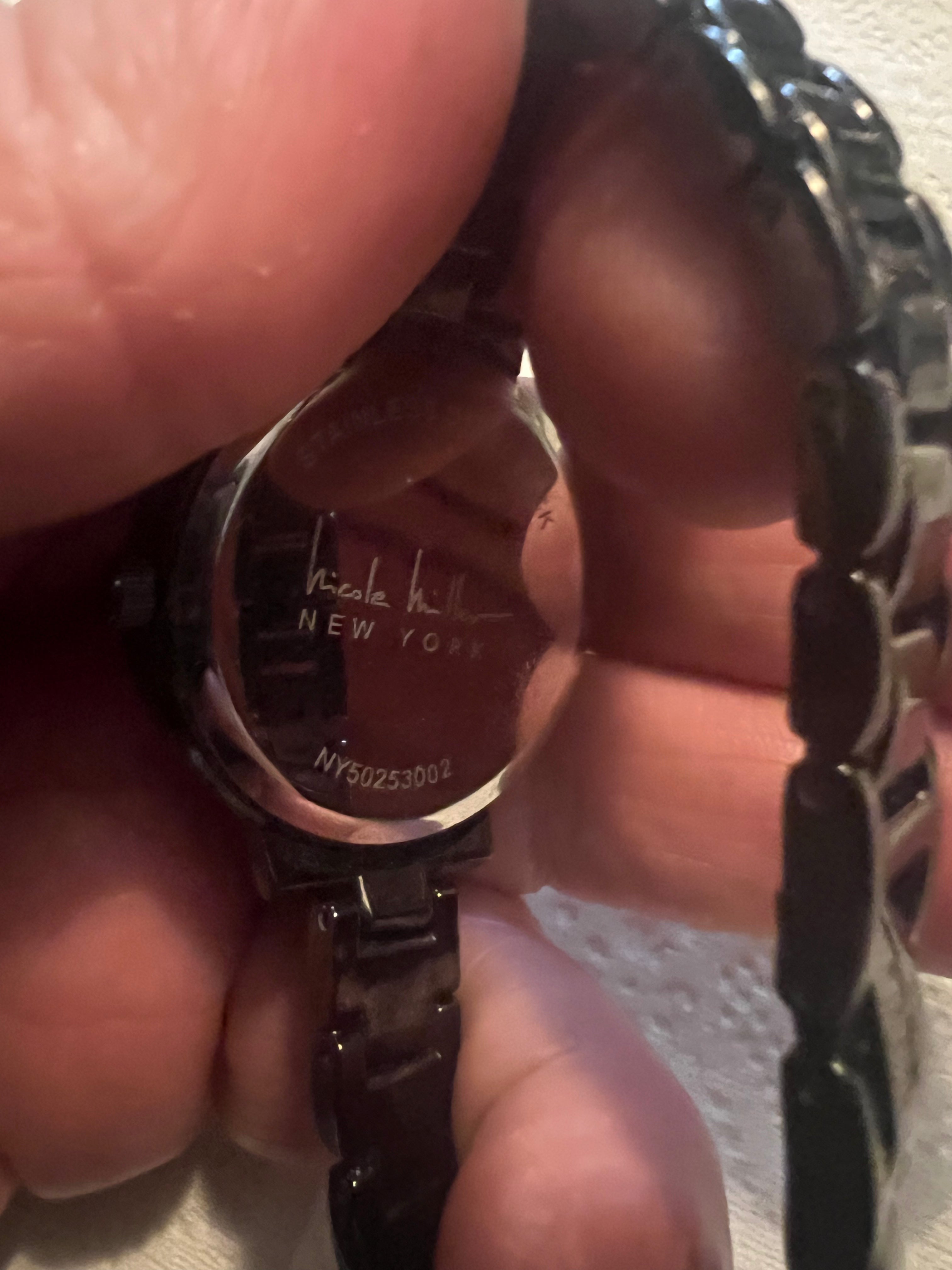 Ladies Nicole Miller dress watch gray embossed detail dial