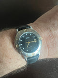 Men’s Perry Ellis America 2 tone watch black leather strap, new battery.