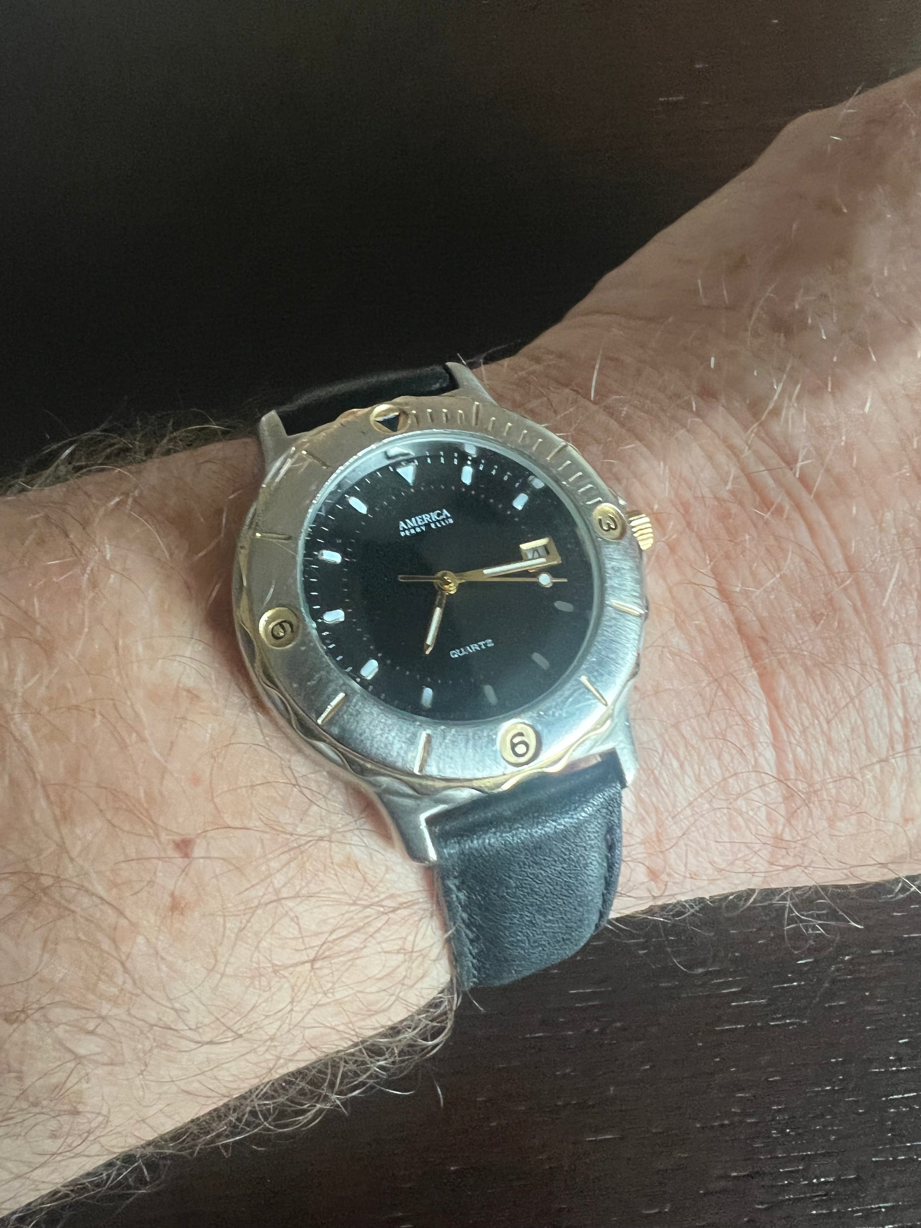 Men’s Perry Ellis America 2 tone watch black leather strap, new battery.